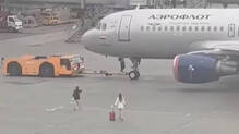 two-women-chase-plane-across-moscow-airport-tarmac-after-missing-flight